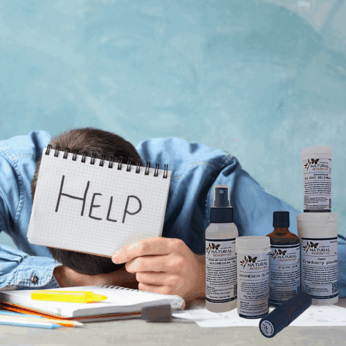 Man exhausted at desk holding a help sign with Burnout Reset Kit products for natural stress relief